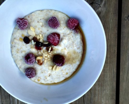healthy-breakfast-porridge-maple-syrup-raspberries-nuts